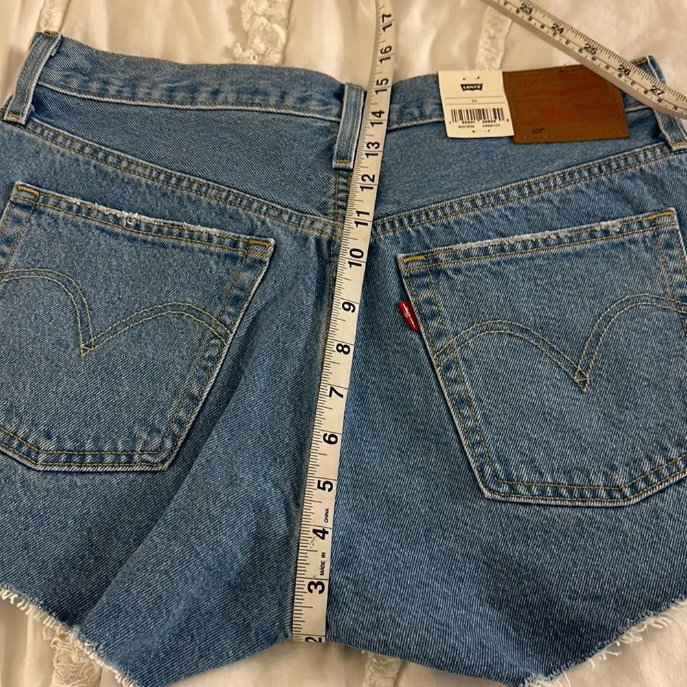 NWT Levi’s 501 denim shorts with raw hem. Size 30. Measurements in pics. - Picture 8 of 10